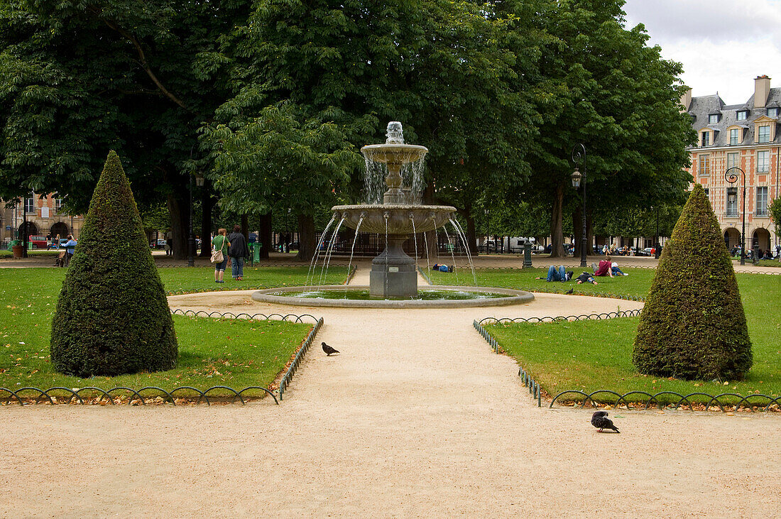 Fountain in Place des Vosges, The Marais, Paris , France