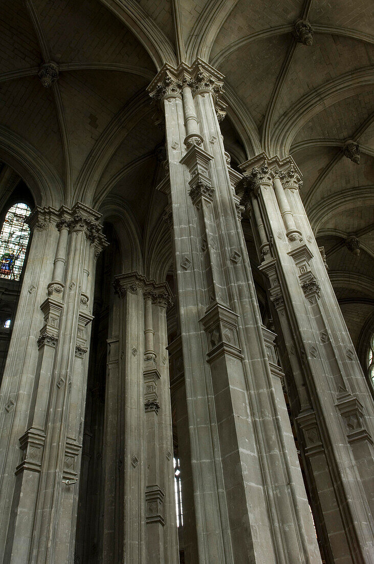 Looking up at the Renaissance pillars and ceiling in Saint Eustache church, Paris, France