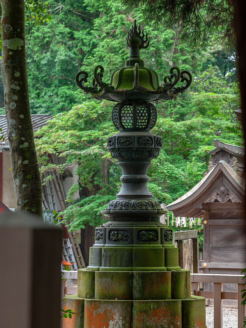 Stone toro, Forest Shinto Shrine entrance, Kashima Jingu, Japan