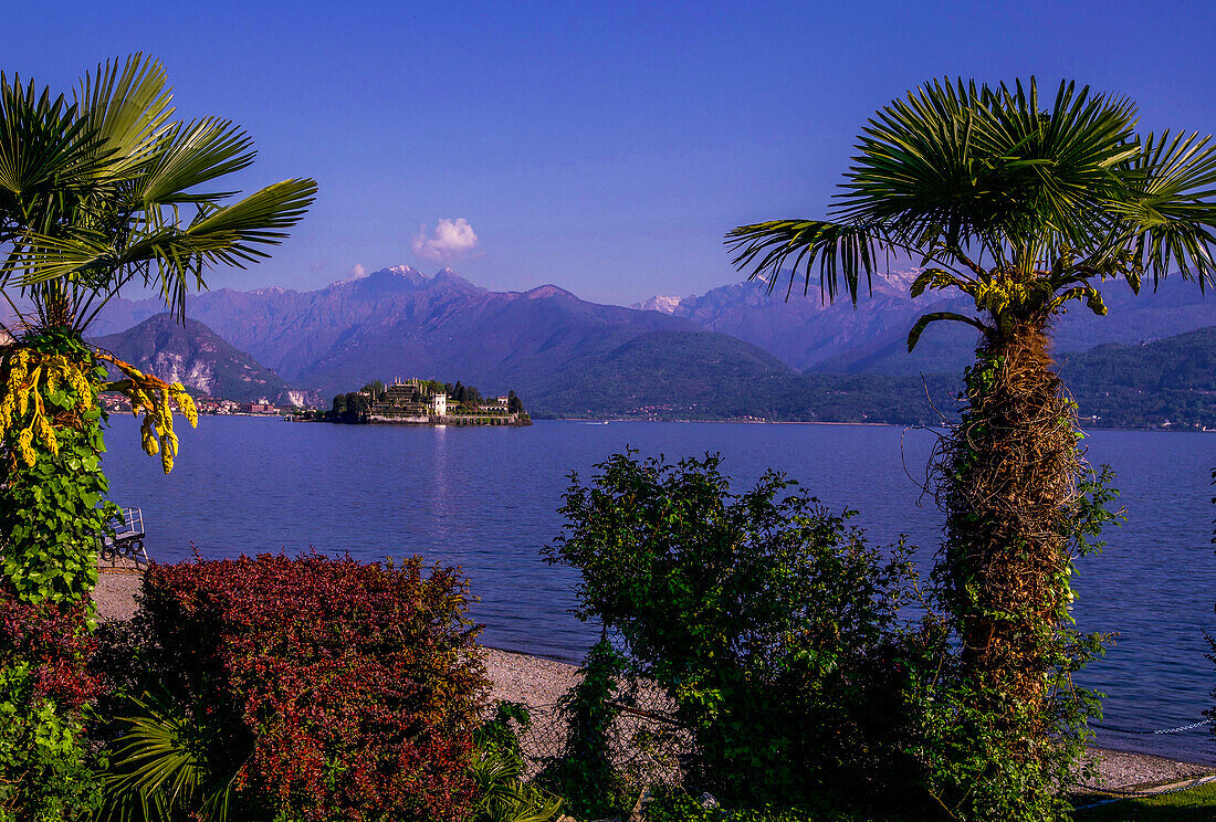View from the lakeside promenade in Stresa towards Isola Bella and the Alps, Lake Maggiore, Piedmont, Italy