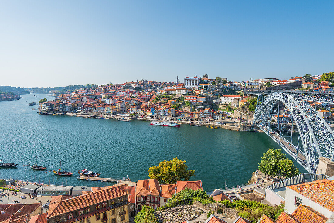 Dom Luís I truss arch bridge over Douro river and historic old town in Porto, Portugal