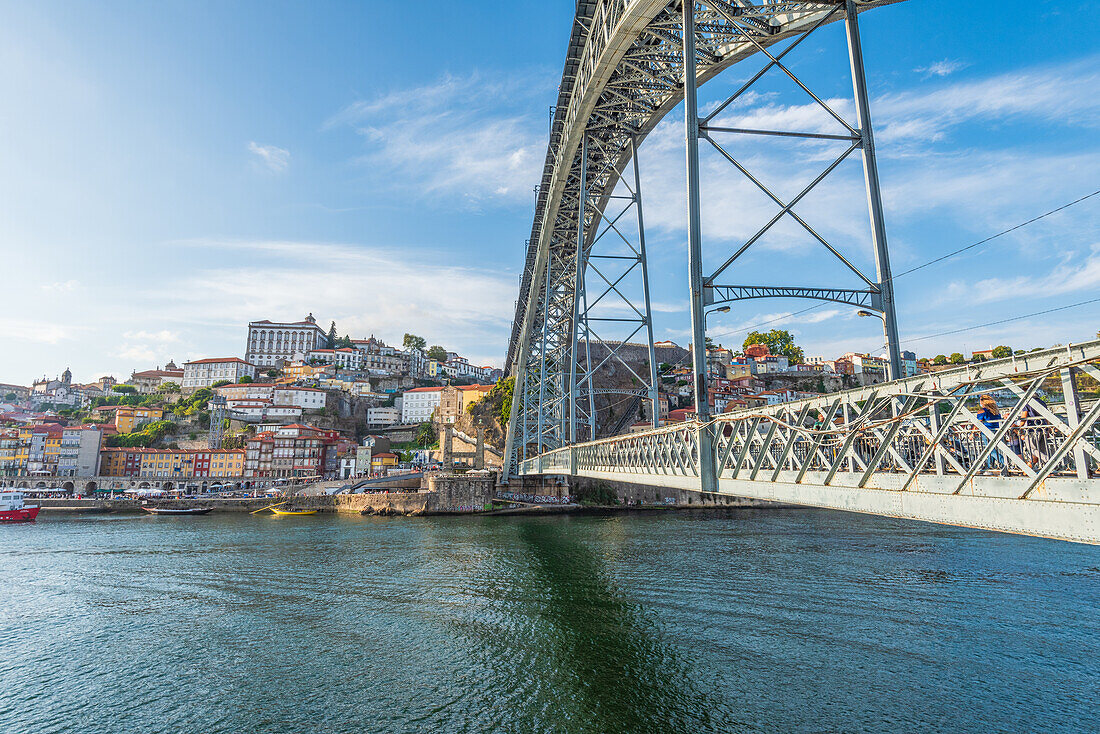 Dom Luís I truss arch bridge over Douro river and historic old town in Porto, Portugal