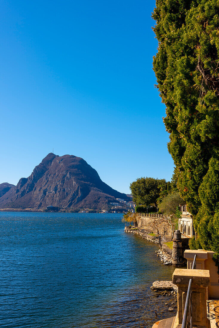 Waterfront on Lake Lugano with Mountain Peak Monte Bre in a Sunny Day with Clear Sky in Lugano, Ticino, Switzerland.