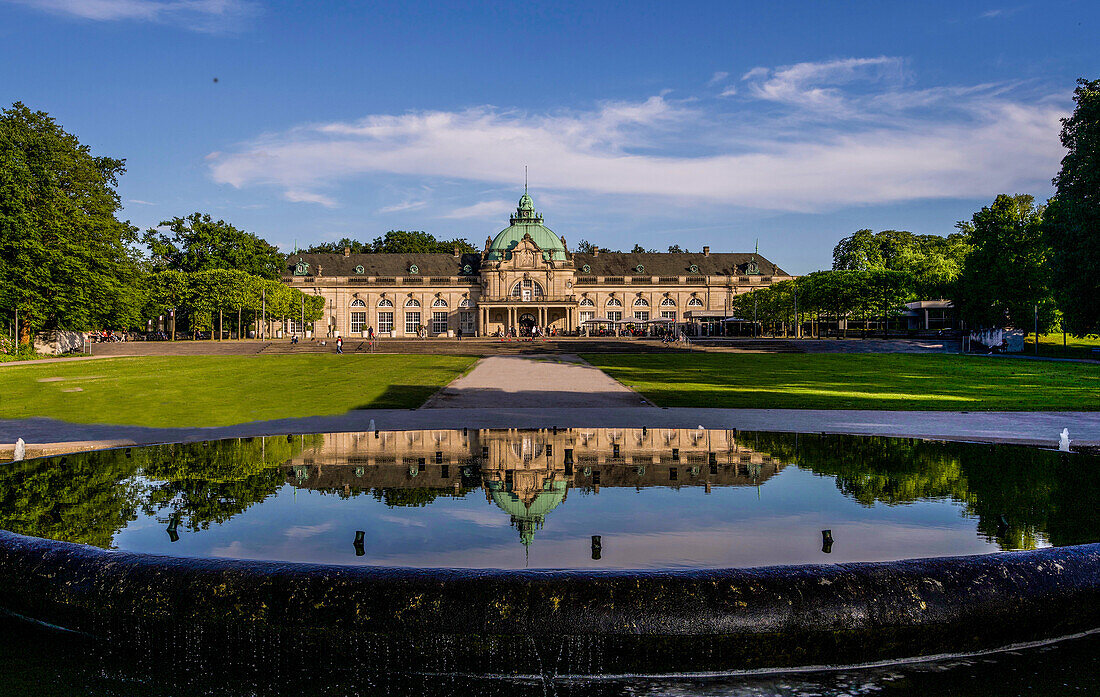 Kaiserpalais in Bad Oeynhausen seen from the fountain on the central axis of the Kurpark, North Rhine-Westphalia, Germany