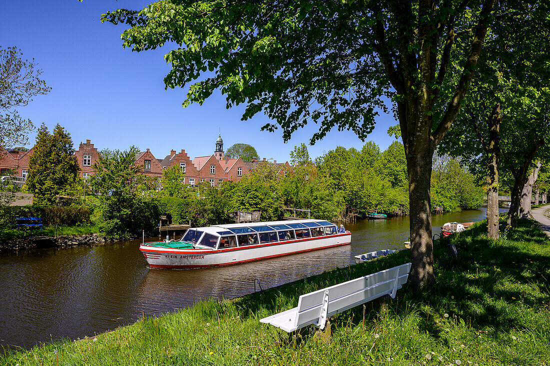 Excursion boat on a canal, city view with canals, Friedrichstadt, North Friesland, North Sea coast, Schleswig Holstein, Germany, Europe