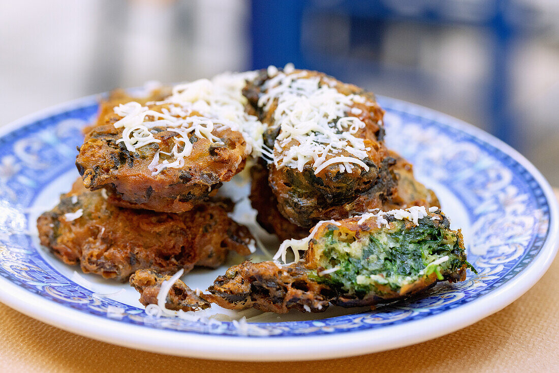 Crispy spinach patties served at the Taverna Blue Chairs Restaurant on the Platea of Vourliotes on the island of Samos in Greece