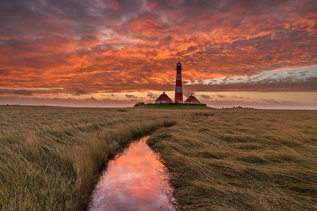 Cloud mood over the Westerhever lighthouse, Westerheversand, Westerhever, Wadden Sea National Park, Schleswig-Holstein, Germany