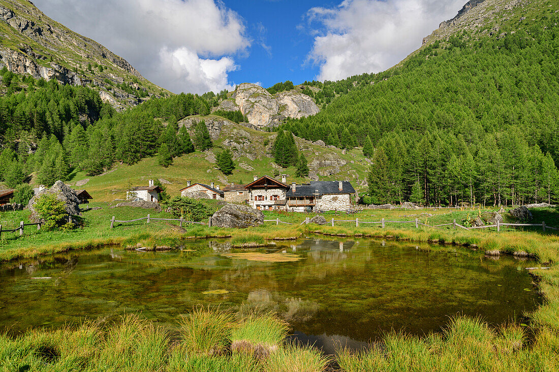 Pond with alpine settlement Le Monal, Rutor Group, Graian Alps, Savoy, Savoie, France