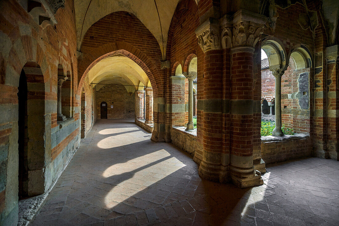 The enchanting cloister of the Abbazia di Vezzolano, Piedmont, Italy, Europe