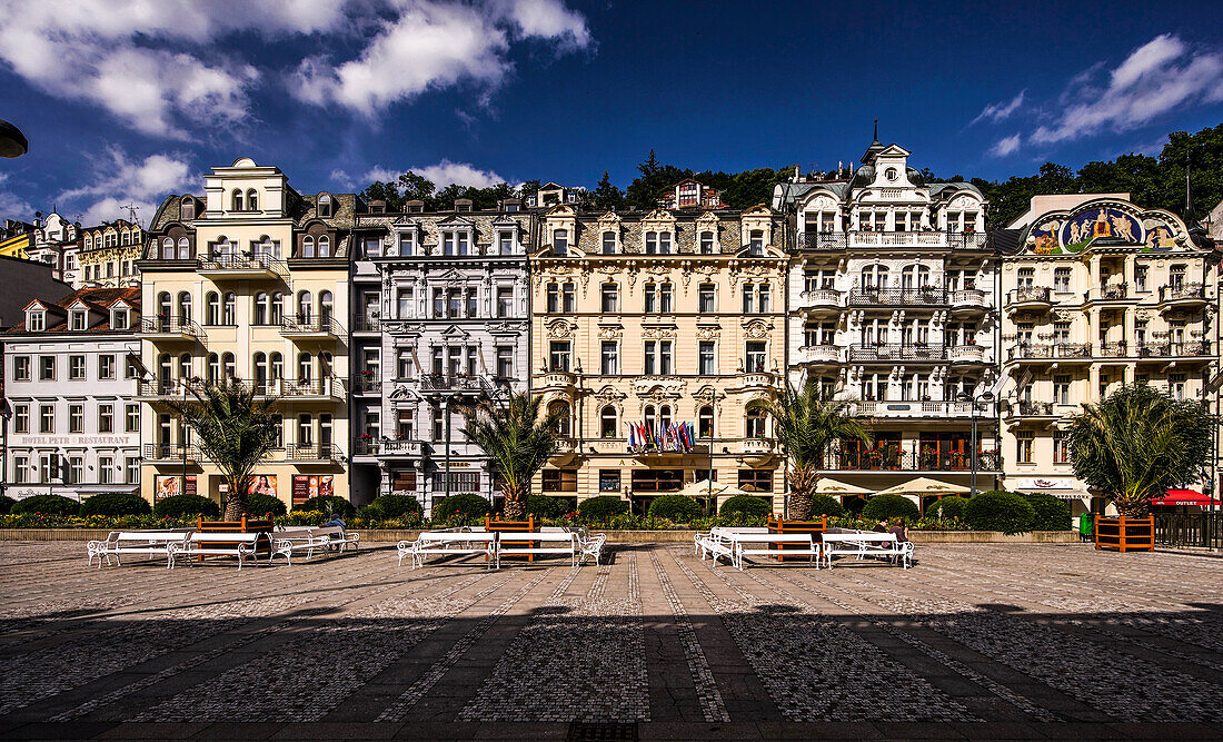 Historic buildings in Cross Street (Vridelny) looking across the promenade in front of the Mill Fountain Colonnade, Karlovy Vary (Karlovy Vary), Czech Republic