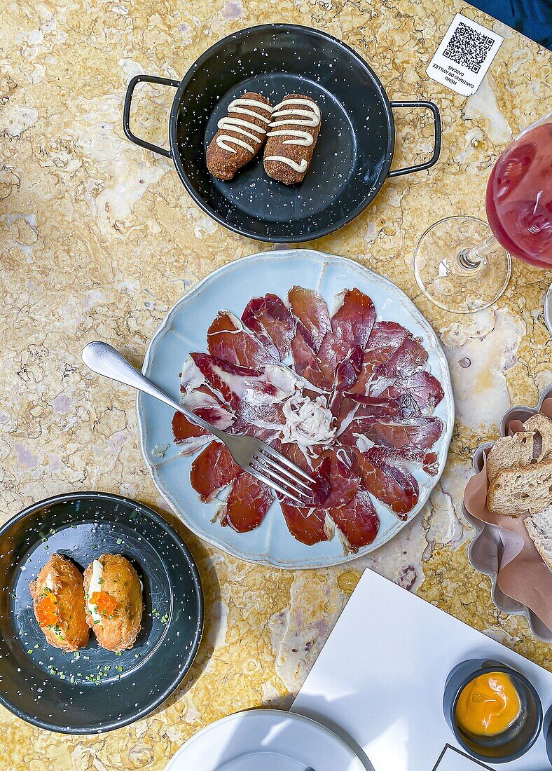 Starters of Cod Fritters with Trout Roe, Dry Cured Iberian Pork and Beef Croquettes with Truffle Mustard at Cantinho Do Avillez in Cascais, Lisbon, Portugal