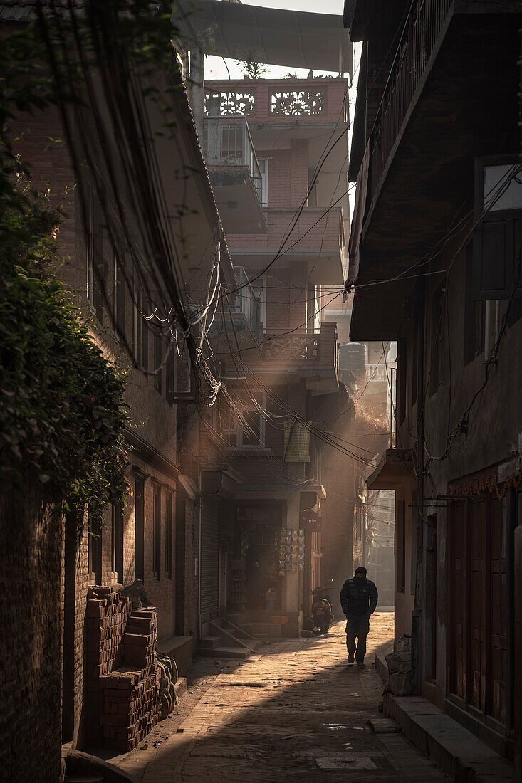 Person in the narrow streets at Durbar Square, Patan, Laitpur, Nepal, Himalaya, Asia
