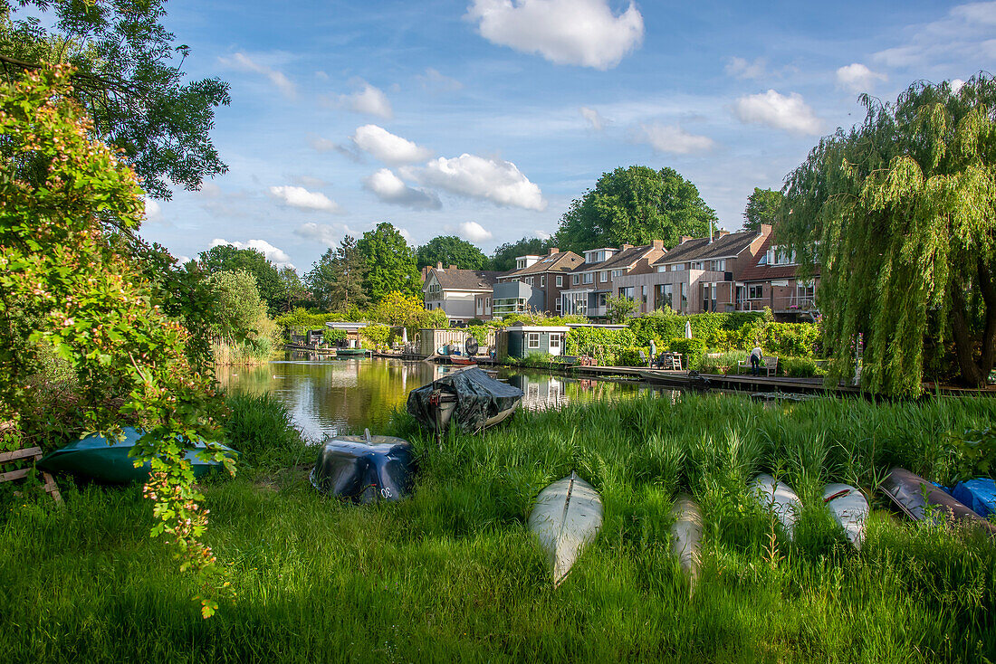 Characteristic apartment buildings at Schellingwouderdijk, Kayaks, Amsterdam, North Holland, Netherlands