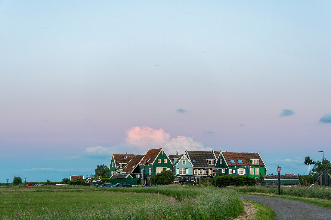 Evening sun, traditional residential houses, Marken peninsula, Waterland, North Holland, Netherlands