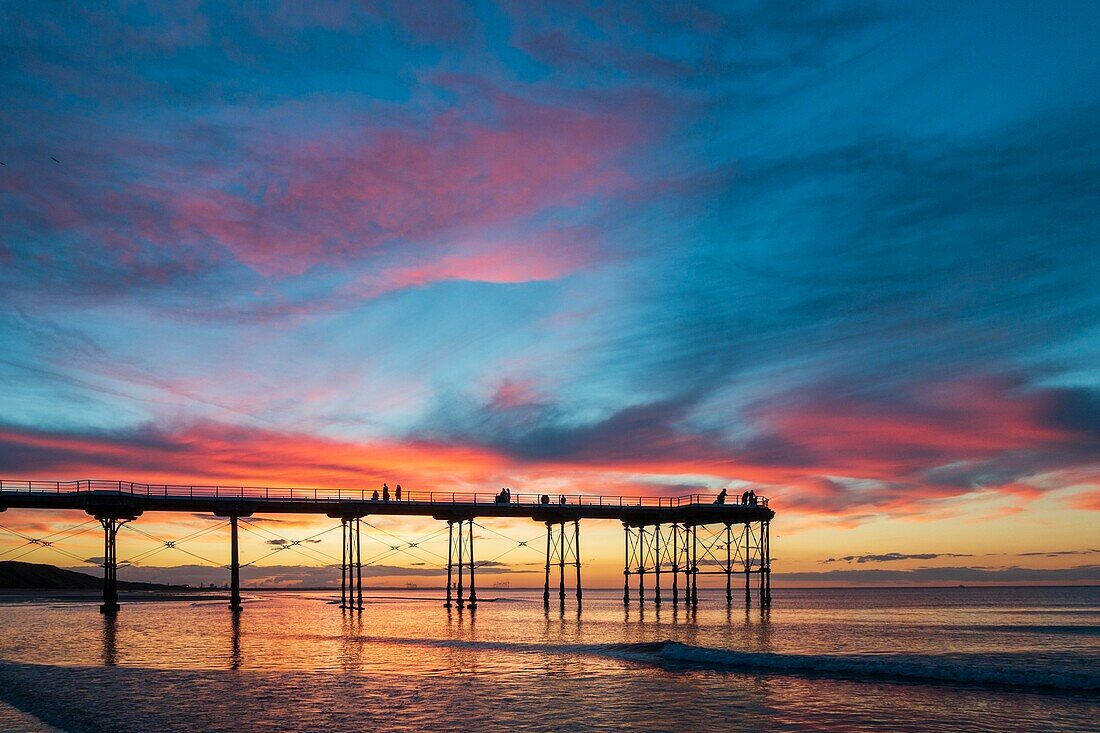 Saltburn by the sea,North Yorkshire,England. United Kingdom. The sun sets behind Saltburn`s Victorian pier; the last remaining pier on the Yorkshire coast.