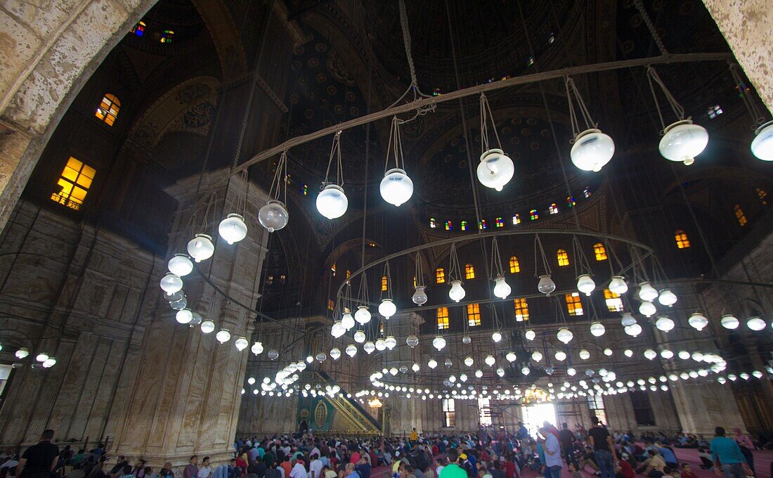 Cairo,Egypt – November 7,2018: photo from inside for Mosque of Muhammad Ali in Cairo city capital of Egypt,it is shown in Ottoman Islamic style and Number lights and tourists,and commissioned by Muhammad Ali Pasha between 1830 and 1848.