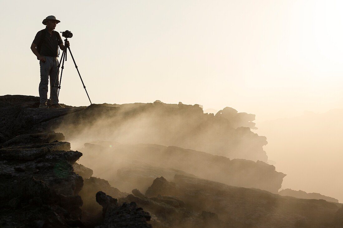 Photographer. Erta Ale volcano in Danakil Depression desert in Ethiopia. Africa.