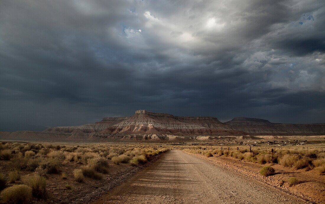 Stormy skies pass through the Southern Utah landscape at sunset.