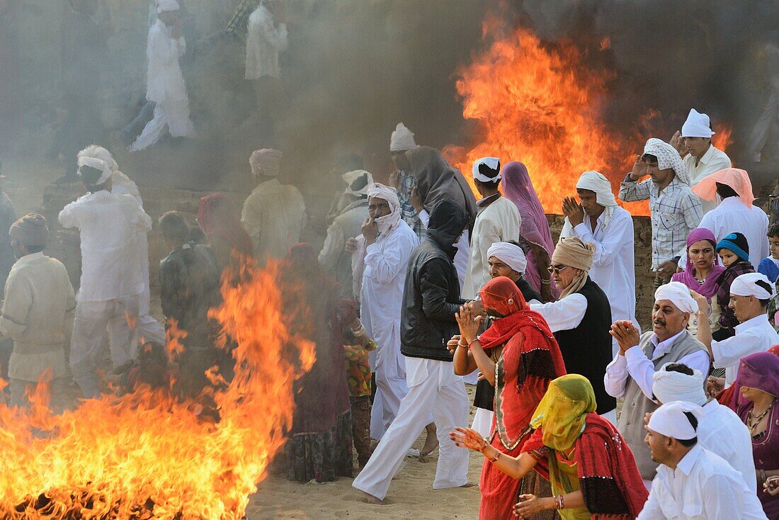 India,Rajasthan,Mukam,Jambeshwar festival,Bishnoi devotees in prayer before Havans or holy fires.