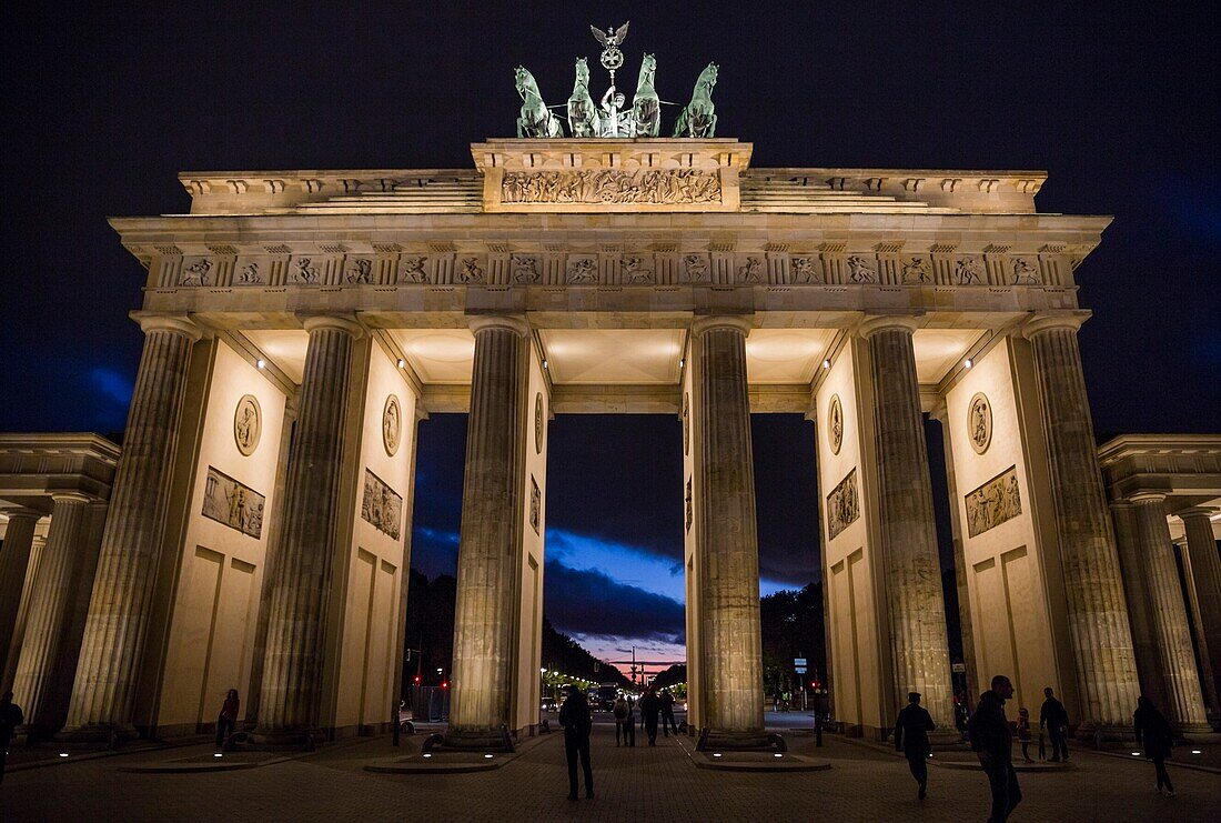 Moody sky behind the Brandenburg Gate at night in Berlin,Germany.