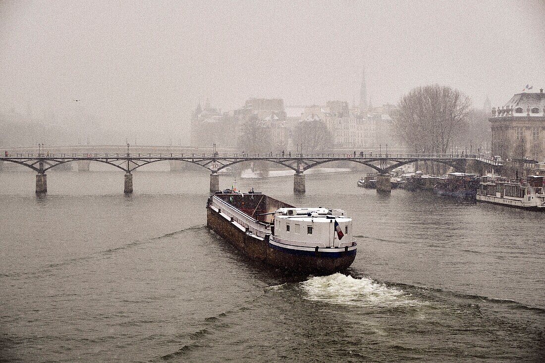 France,Paris,the Passerelle des Arts,Ile de la Cite and the cathedrale Notre Dame of Paris in winter.