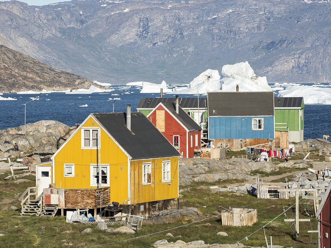 Small fishing village Ikerasak on Ikerask island in the Uummannaq Fjord System. America,North America,Greenland,Uummannaq.