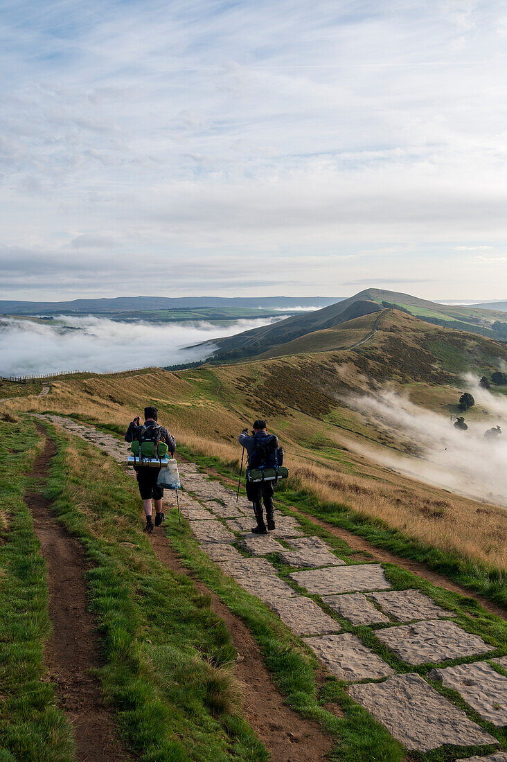 Hikers on The Great Ridge with cloud inversion, Edale, The Peak District, Derbyshire, England, United Kingdom, Europe