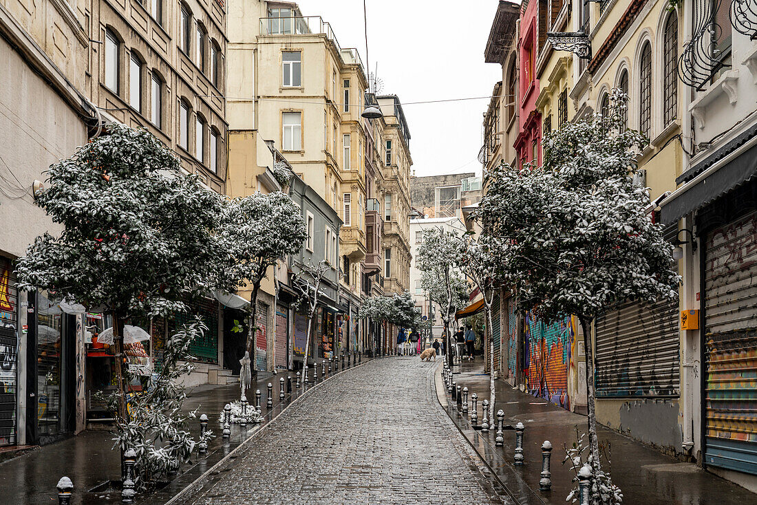 Turkey, Istanbul, Old street with cafes and shops in winter