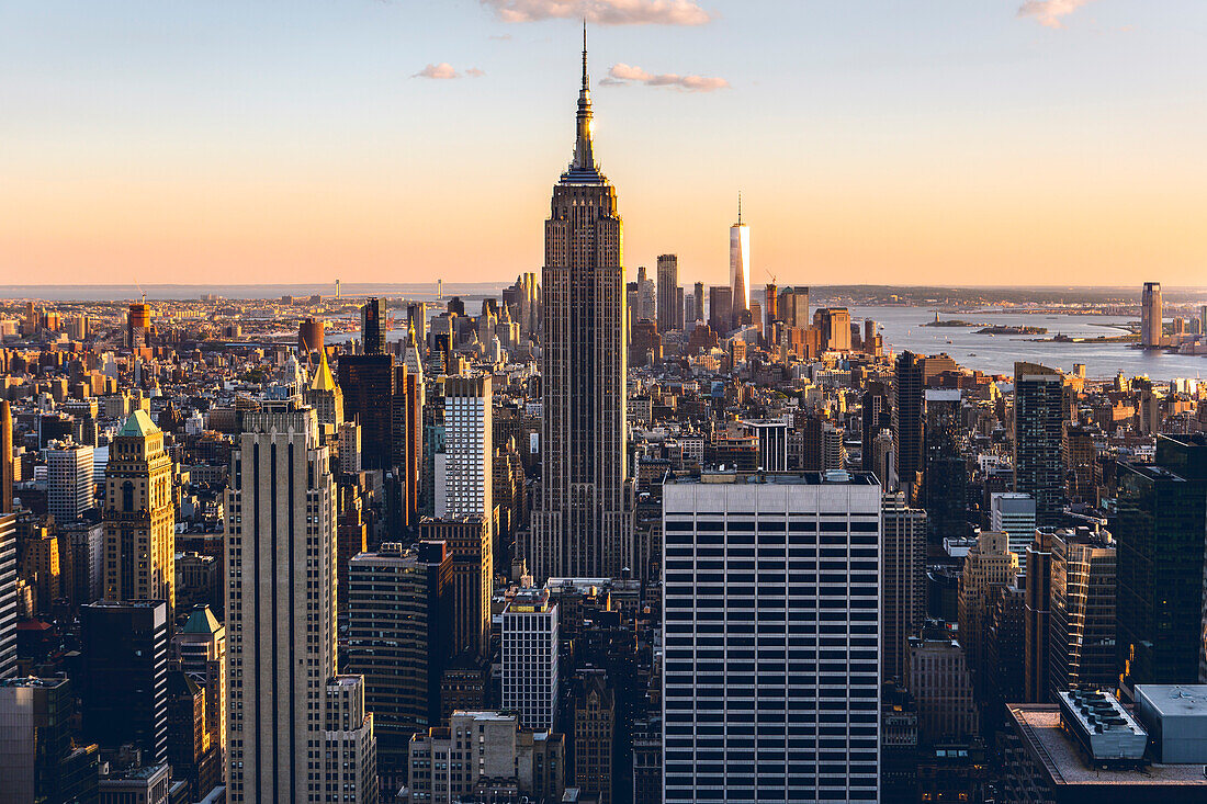 USA, New York City, Empire State Building and Manhattan skyscrapers at sunset