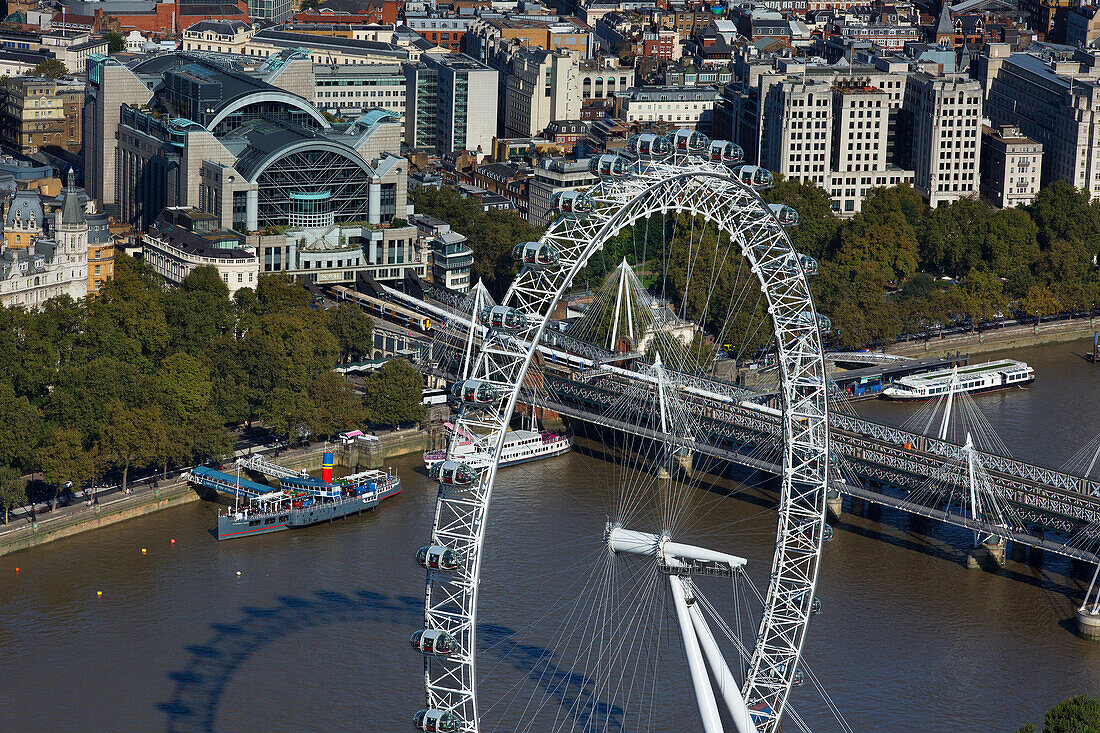 UK, London, London Eye, Charing Cross railway station and river Thames