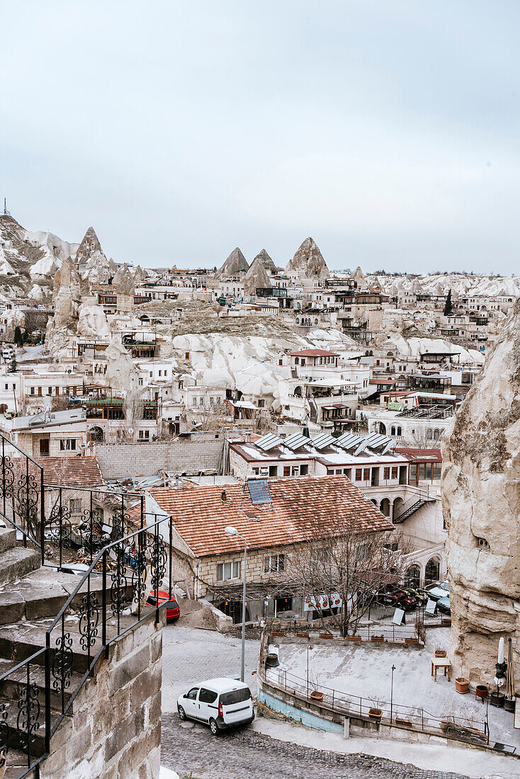 Turkey, Cappadocia, Goreme, Buildings and fairy chimneys in Winter