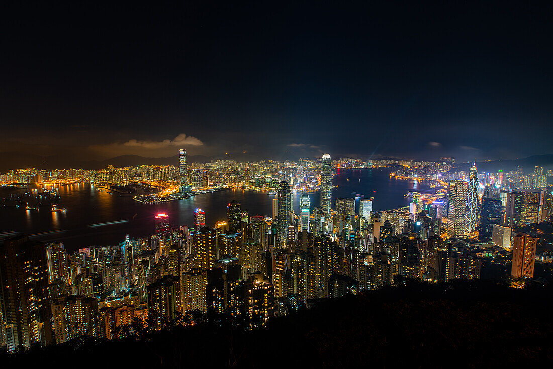 Aerial view of illuminated cityscape with Victoria Harbour in Hong Kong