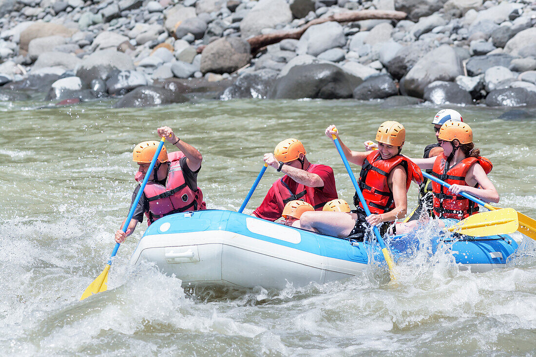 A group of people whitewater rafting, Costa Rica, Central America