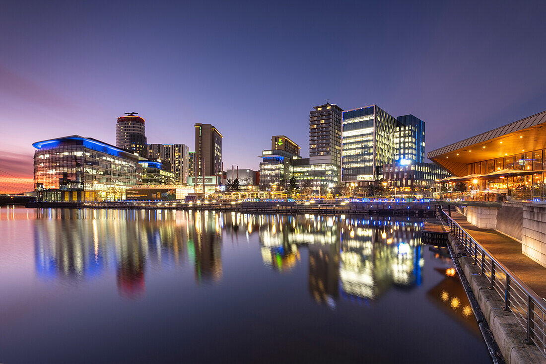 MediaCityUK reflected in North Bay at night, Salford Quays, Salford, Manchester, England, United Kingdom, Europe