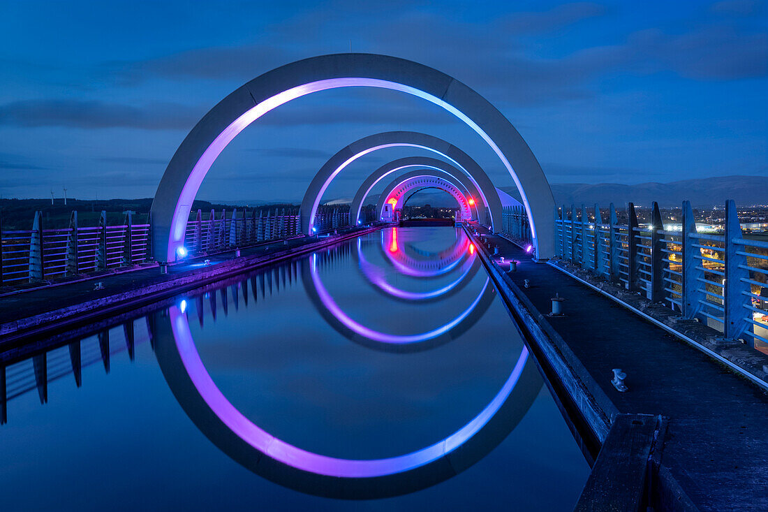 The Falkirk Wheel on the Union Canal illuminated at night, Falkirk, Stirlingshire, Scotland, United Kingdom, Europe