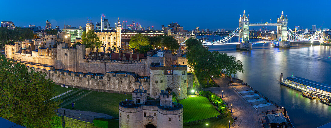 View of the Tower of London, UNESCO World Heritage Site, and Tower Bridge from Cheval Three Quays at dusk, London, England, United Kingdom, Europe