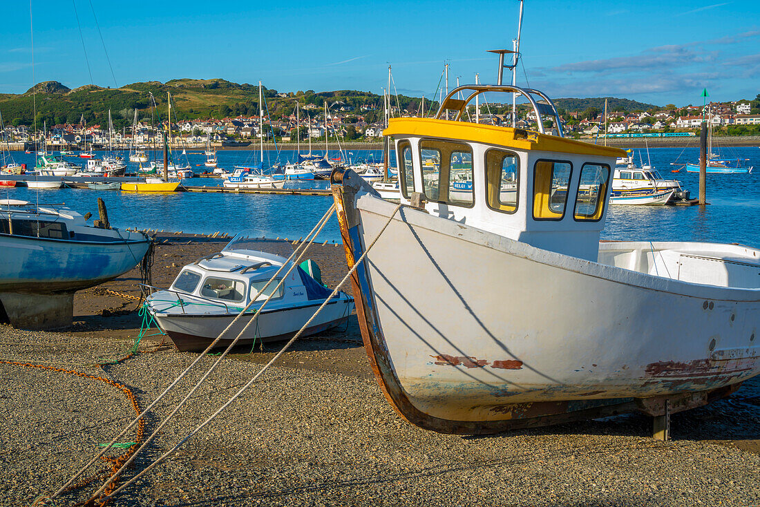 View of boats on the beach with Conwy River visible in background, Conwy, Gwynedd, North Wales, United Kingdom, Europe