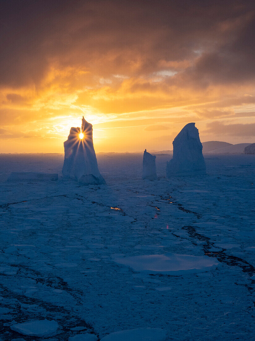 Sunset over an unusual iceberg near Petermann Island, Antarctica, Polar Regions