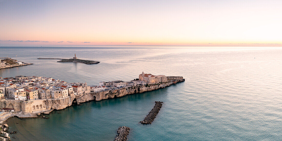 Aerial view of old town and lighthouse of Vieste at dawn, Foggia province, Gargano National Park, Apulia, Italy, Europe