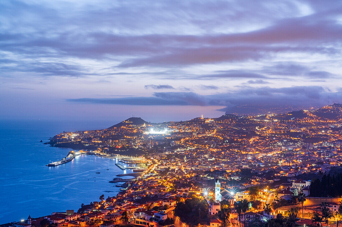 Dusk over the iIluminated city of Funchal viewed from Sao Goncalo, Madeira island, Portugal, Atlantic, Europe