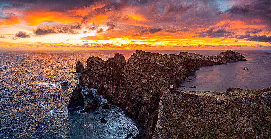 Cliffs by the ocean under the burning sky at dawn, Ponta Do Rosto, Sao Lourenco Peninsula, Madeira island, Portugal, Atlantic, Europe