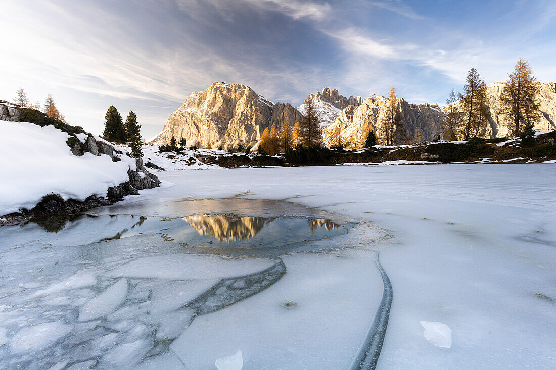 Lagazuoi mountain mirrored in the icy lake Limides at dawn, Ampezzo Dolomites, Belluno province, Veneto, Italy, Europe