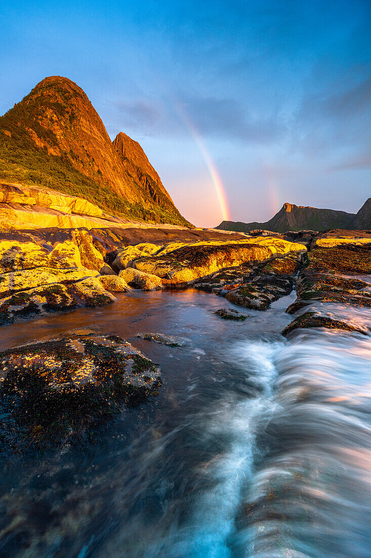 Rainbow over mountains and Arctic sea from Tungeneset viewpoint, Senja, Troms county, Norway, Scandinavia, Europe