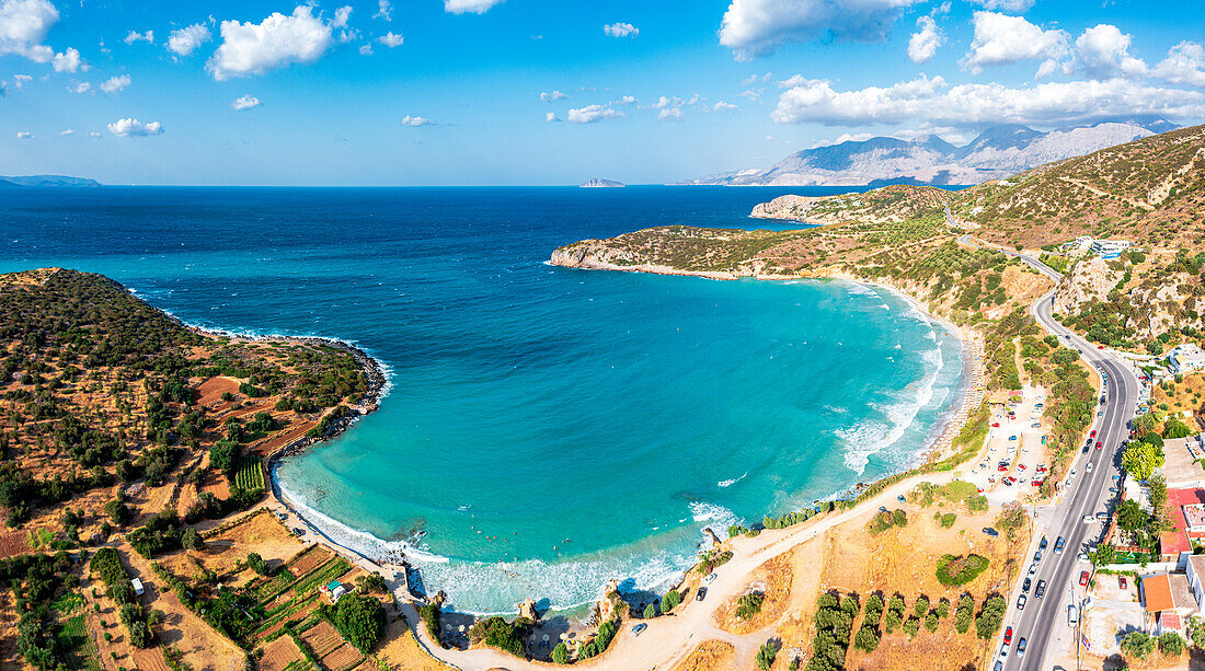 Aerial view of Almyros Beach washed by the turquoise sea in the gulf of Mirabella, Agios Nikolaos, Crete island, Greek Islands, Greece, Europe