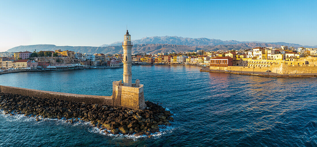 Aerial view of lighthouse and harbour of Chania old town at sunrise, island of Crete, Greek Islands, Greece, Europe