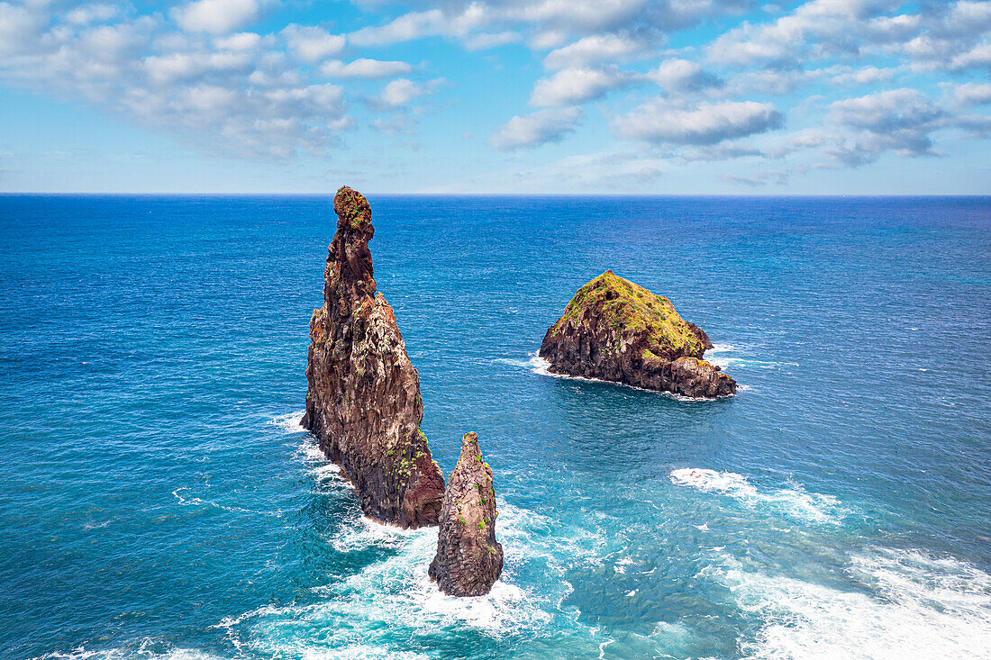 Aerial view of rock formation Ilheus da Rib and Ribeira da Janela in the rough ocean, Porto Moniz, Madeira island, Portugal, Atlantic, Europe