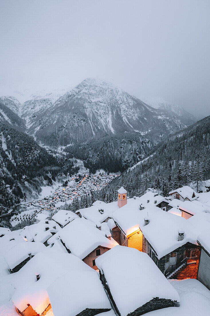 Mountain huts covered with snow in the alpine village of Starleggia, Campodolcino, Valchiavenna, Valtellina, Lombardy, Italy, Europe