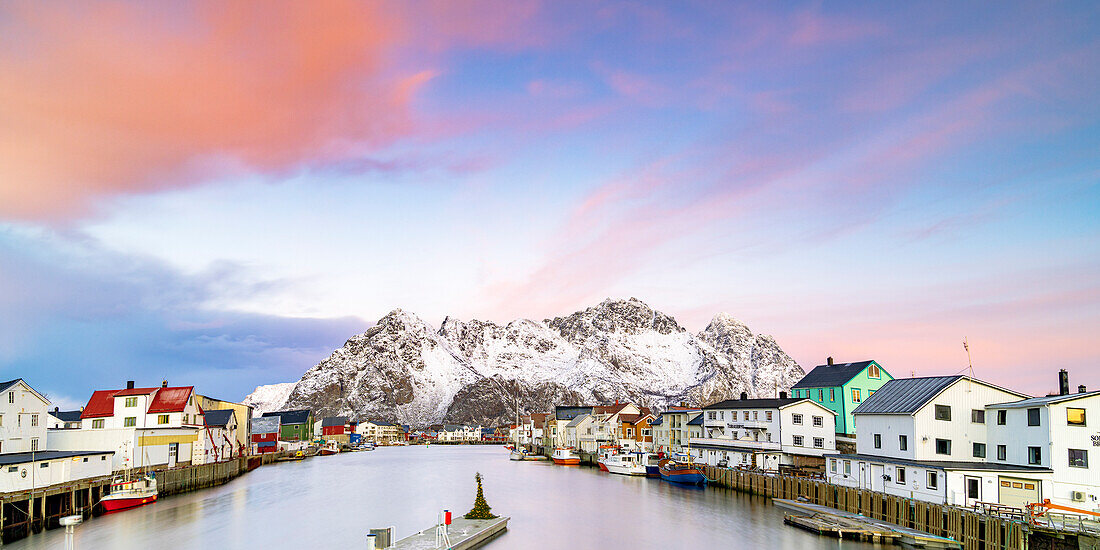 Pink Arctic sunrise over traditional houses in the fishing village of Henningsvaer in winter, Nordland, Lofoten Islands, Norway, Scandinavia, Europe