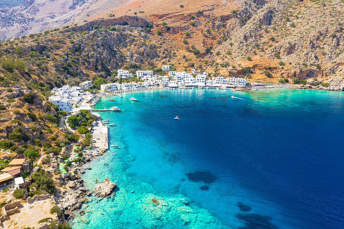 Aerial view of traditional whitewashed buildings of Loutro village and transparent sea, Crete island, Greek Islands, Greece, Europe