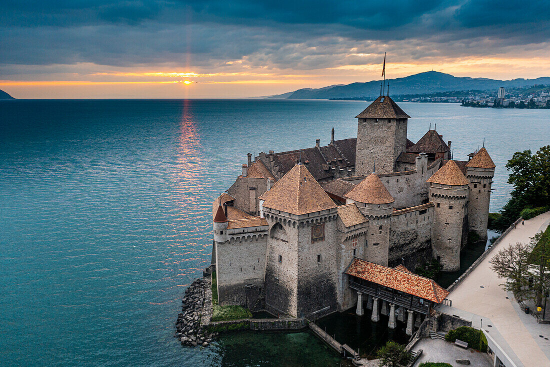 Aerial of Chillon Castle at sunset, Lake Geneva, Switzerland, Europe